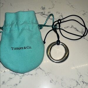 Tiffany & Co. Elsa Peretti Sterling Silver Necklace with silk black cord.